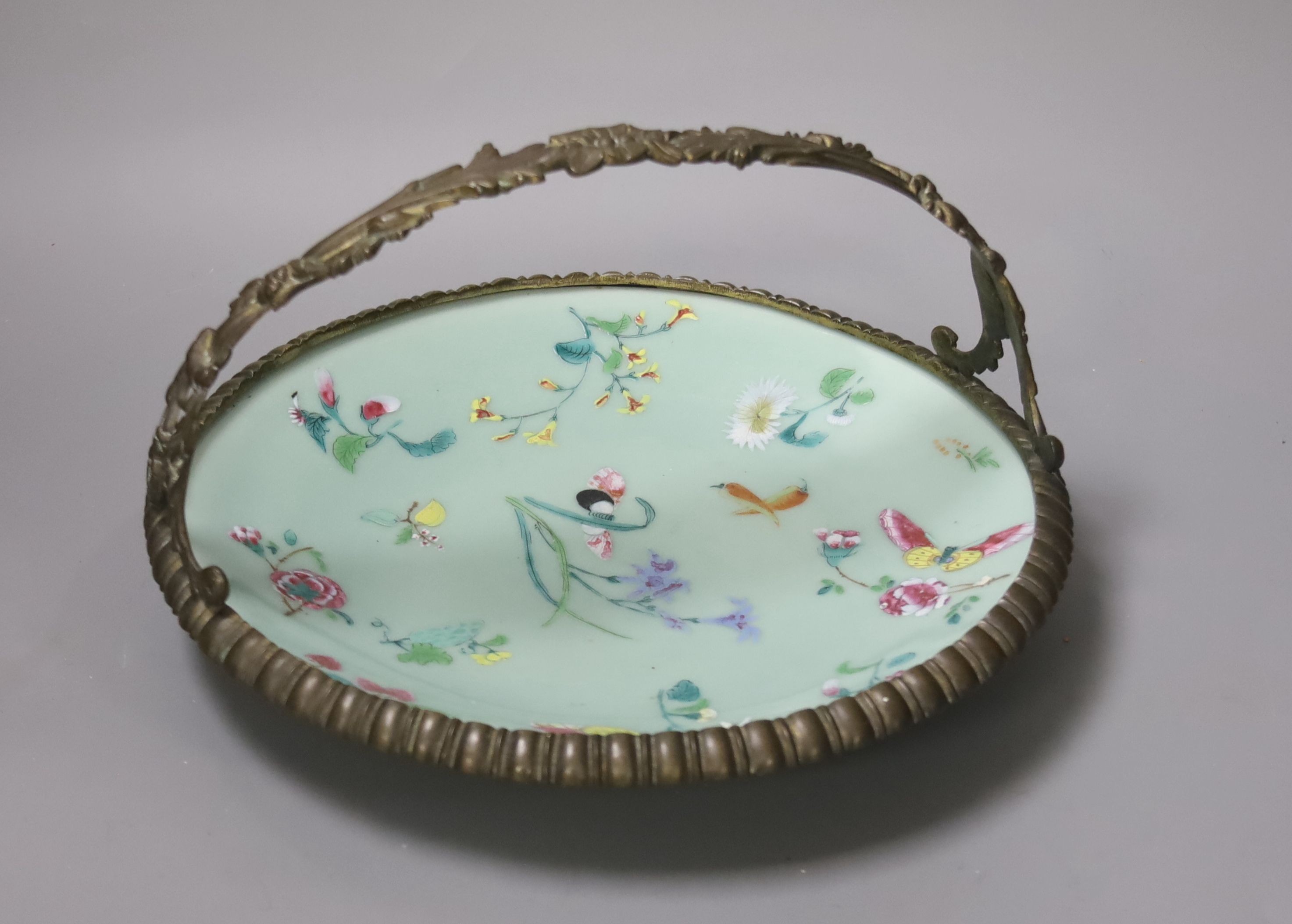 A 19th century Chinese celadon ground circular dish, with European bronze basket mount, Diameter 27cm